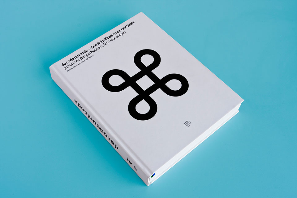the decodeunicode book lying on a blue background
